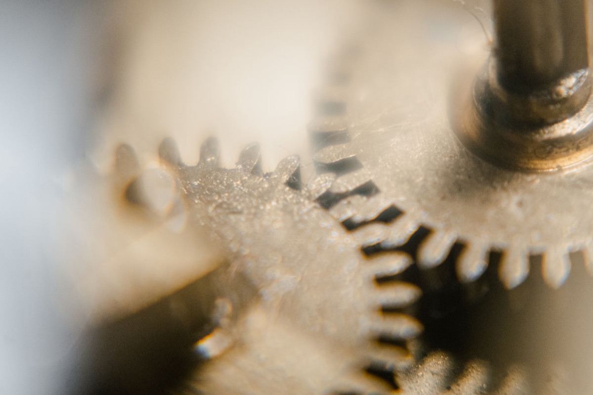 Close-up of intricate metal clockwork gears working together.