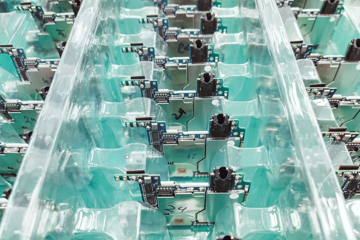 Detailed view of golden circuit board pathways connecting components.